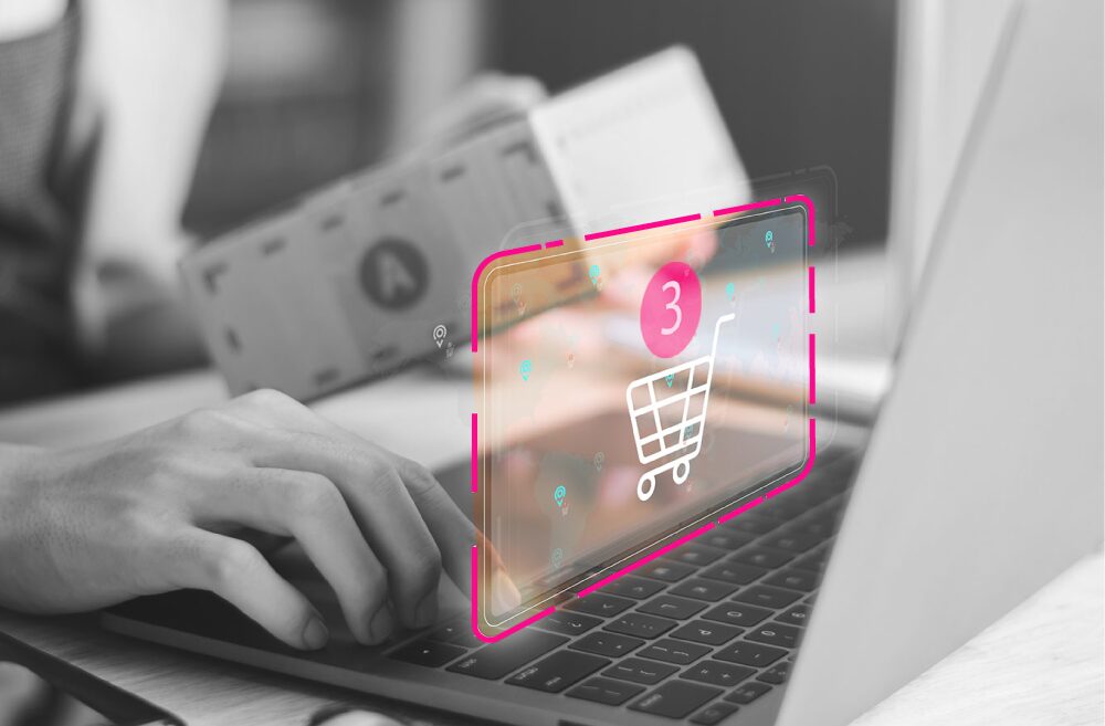 Icono de carrito de compras digital sobre laptop representando pagos digitales y comercio electrónico con Puntored