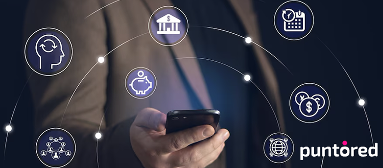 Celular en mano con íconos financieros y de pagos digitales, representando Fintech as a Service de Puntored